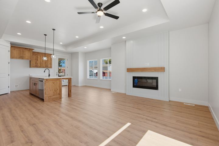 Isom Estates great room with fireplace and kitchen