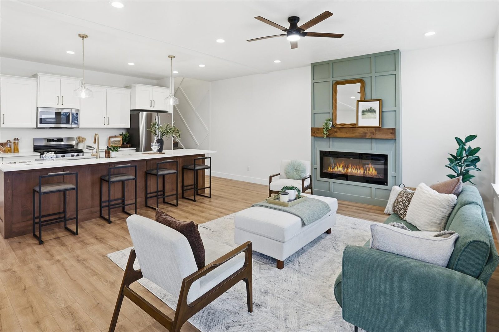 Open kitchen and living room with custom fireplace