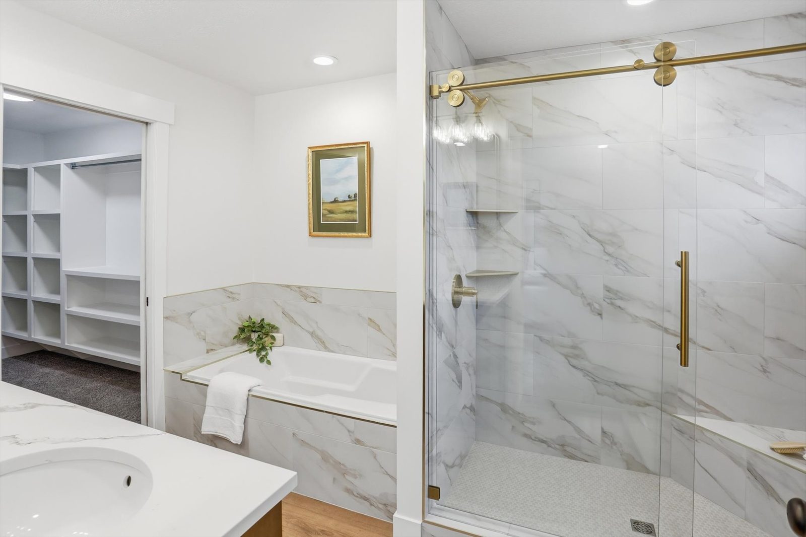 Primary bath with soaker tub and glass shower