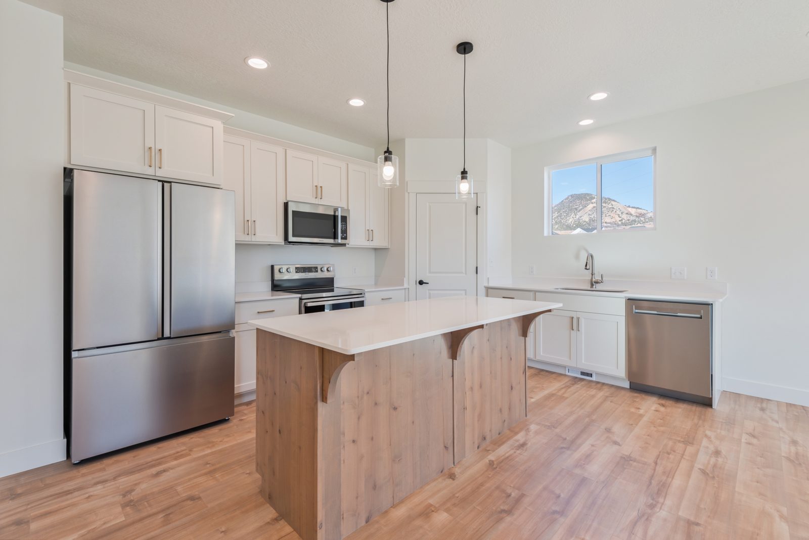 White kitchen with mountain-view window