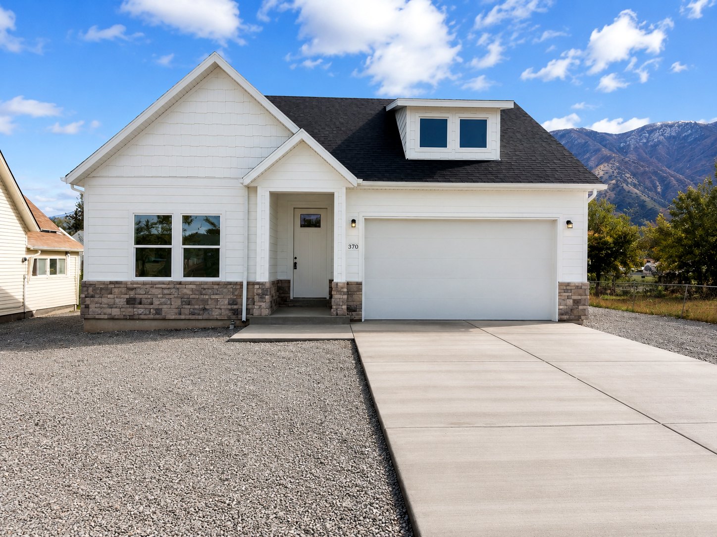 Single-family home exterior with stone accents